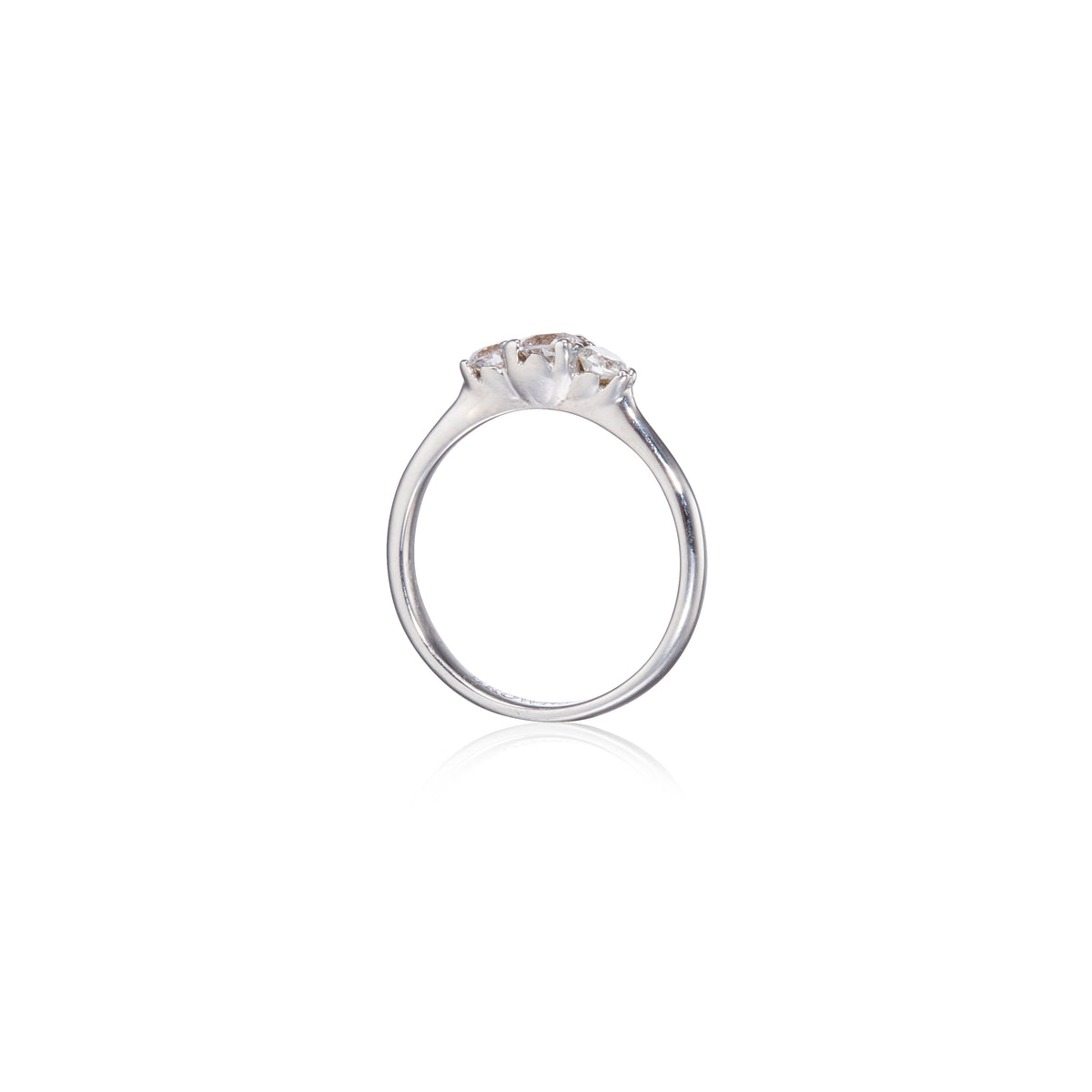 White gold ring with a diamond on a white background