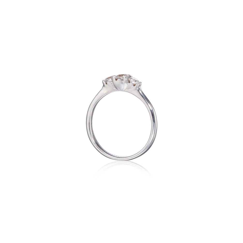 White gold ring with a diamond on a white background