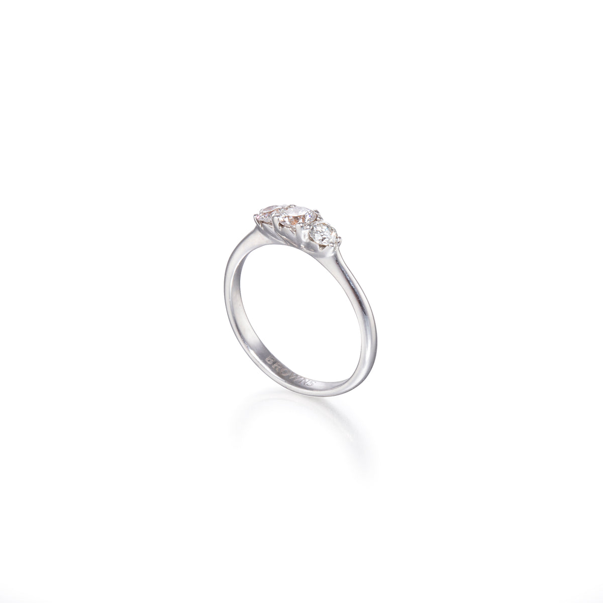 White gold ring with three diamonds on a white background