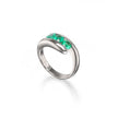 A platinum curved ring featuring a row of vibrant green emerald-cut gemstones across the top, displayed on a clean white background with a soft reflection.