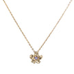 A delicate gold chain necklace featuring a small gold flower pendant with a tiny purple gemstone in the center, set against a plain white background.