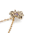 A gold flower-shaped pendant necklace with a small purple gemstone in the center, shown on a clean white background.