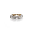 A vintage-style diamond band ring with a yellow gold inner band and a white gold outer band paved with small clear stones, shown on a white background with a soft reflection.