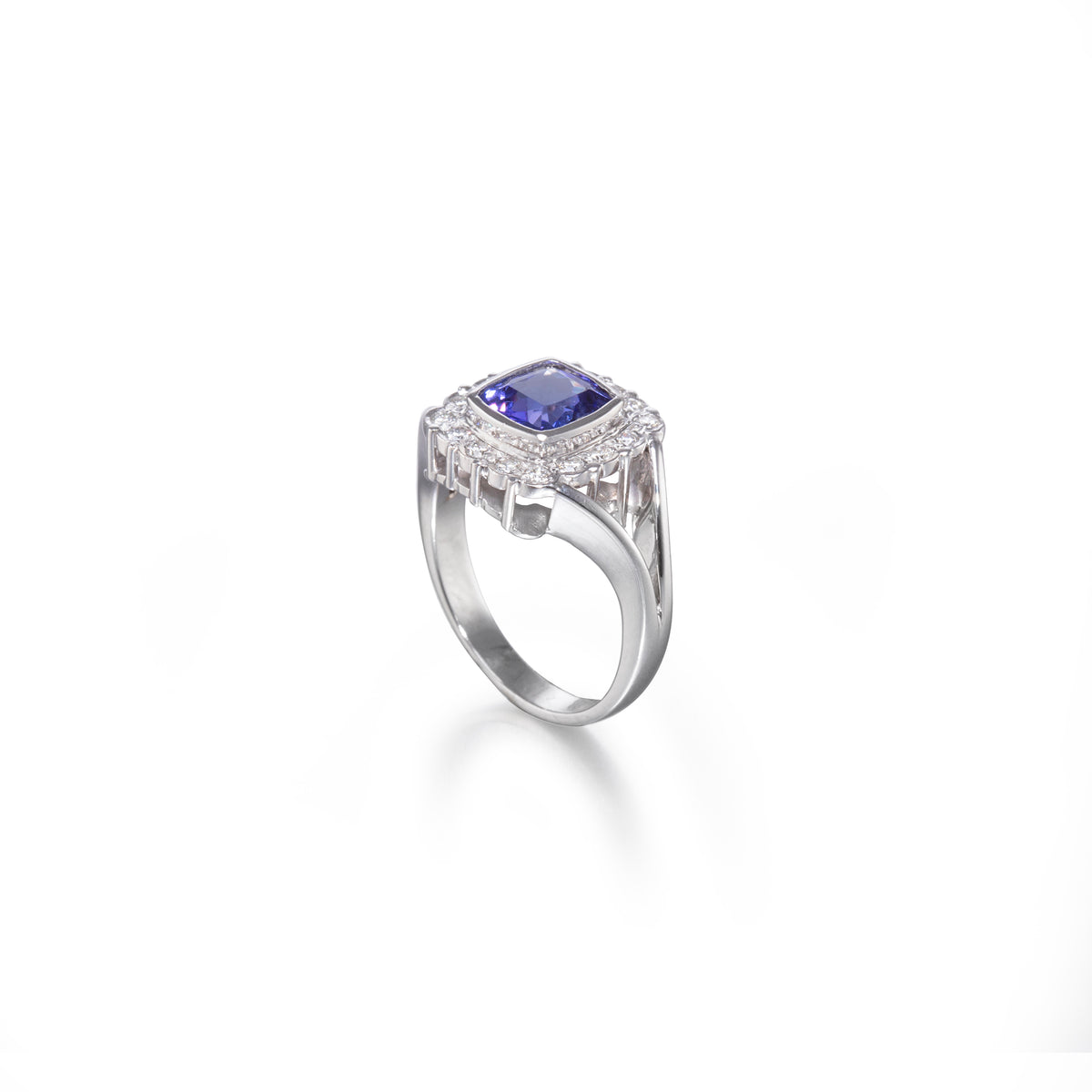 18ct White Gold Cushion Cut Tanzanite and Diamond Halo Ring