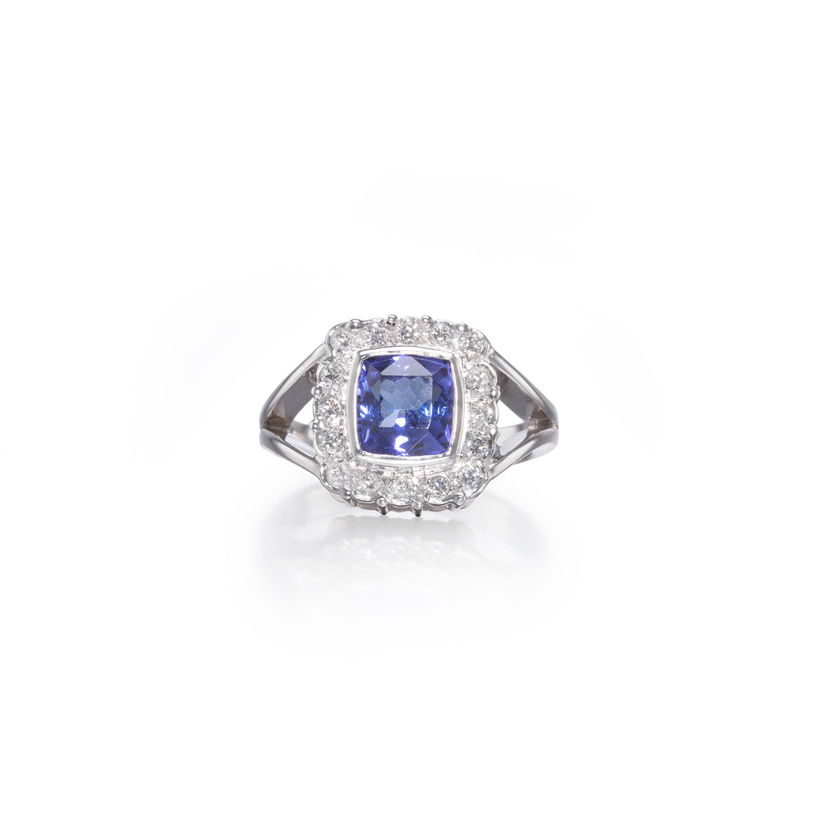 18ct White Gold Cushion Cut Tanzanite and Diamond Halo Ring
