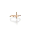 Gold cross-shaped ring with embedded diamonds on a white background