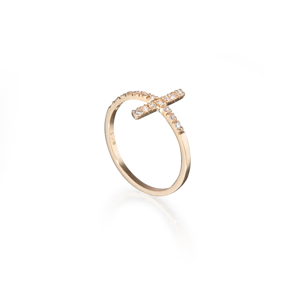 Yellow Gold ring with a cross design on a white background