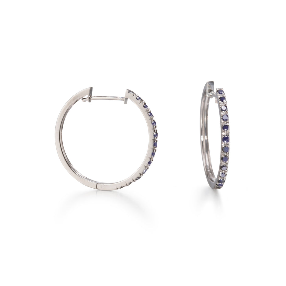 White Gold Black Diamond Huggie Earrings on white background