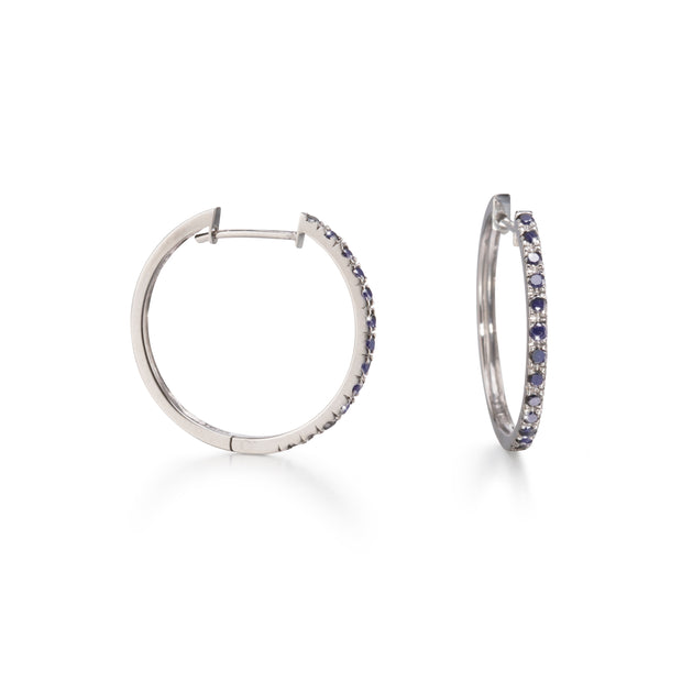 White Gold Black Diamond Huggie Earrings on white background