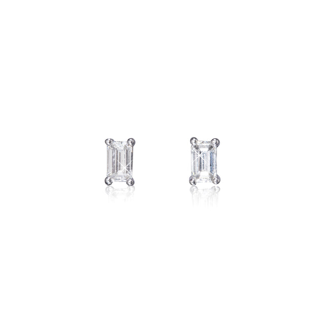 Pair of diamond stud earrings on a white background