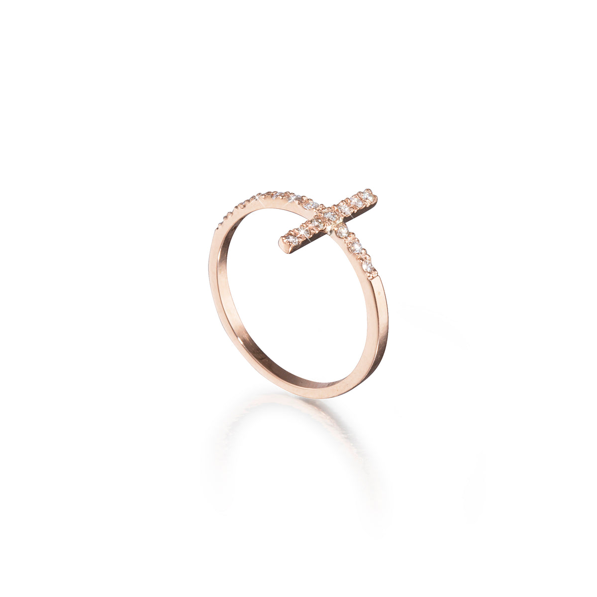 Rose gold ring with a cross design on a white background