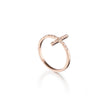 Rose gold ring with a cross design on a white background