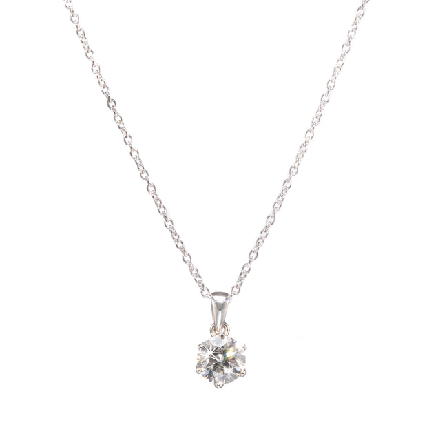 Platinum necklace with a clear gemstone pendant on a white background