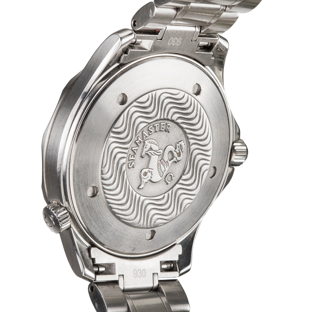 Close-up of the back of a stainless steel wristwatch with a wavy engraved pattern and the brand name 'GRAAMSTER' visible in the center.
