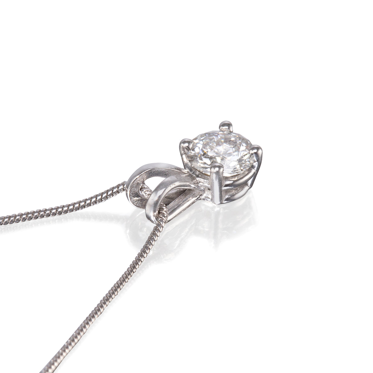 Platinum 4 Claw Solitaire Diamond Pendant with a Platinum Snake Chain close up view on white background