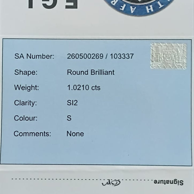 Diamond certification card with EGL South Africa logo and diamond details.