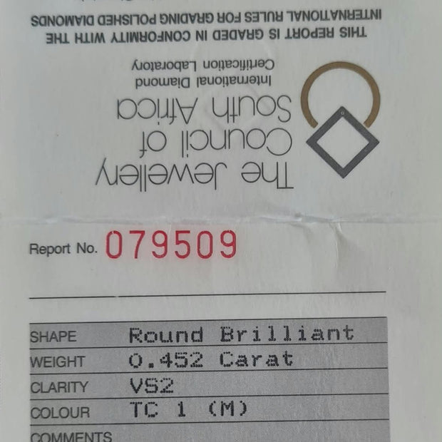 A white diamond certification report card from The Jewellery Council of South Africa and International Diamond Certification Laboratory, showing details for a round brilliant-cut diamond with a 0.452 carat weight and VS2 clarity.