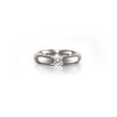 A classic solitaire engagement ring featuring a round brilliant-cut diamond set in a polished platinum band, centered on a clean white background with a soft reflection.