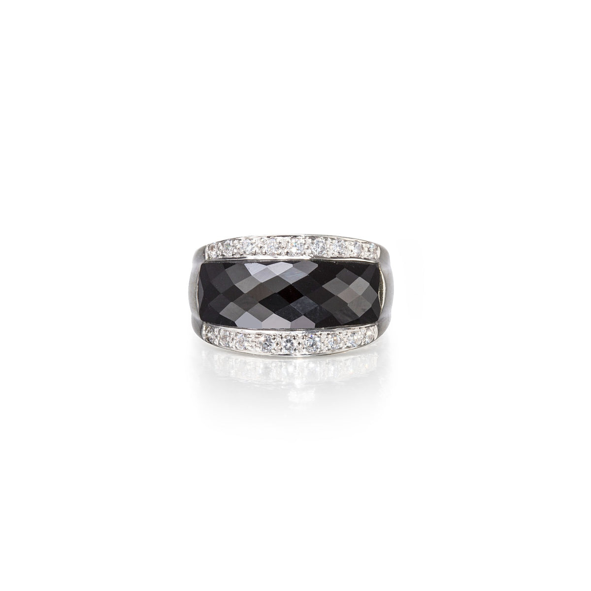 Ring with black gemstone and diamond-studded band on a white background