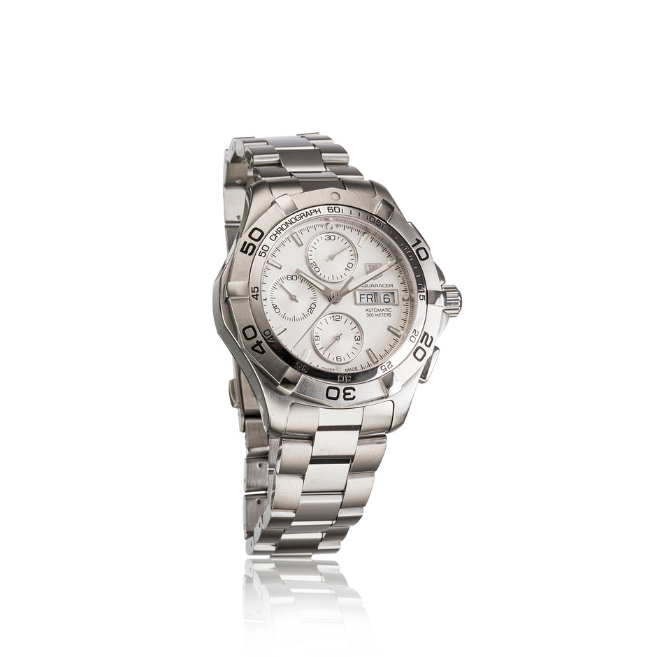 A stainless steel chronograph watch with a silver-tone metal link bracelet, featuring a white dial with multiple subdials, a rotating bezel, and a date window.