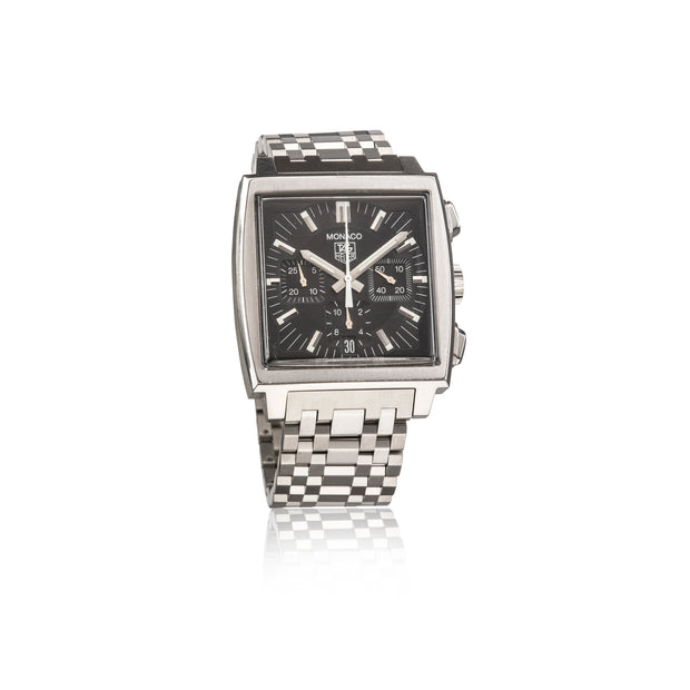 A silver-tone stainless steel watch with a square bezel, black dial, and a checkered metal link bracelet, shown on a white background with a faint reflection.