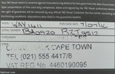 A close-up of a TAG Heuer watch warranty card with printed and handwritten text