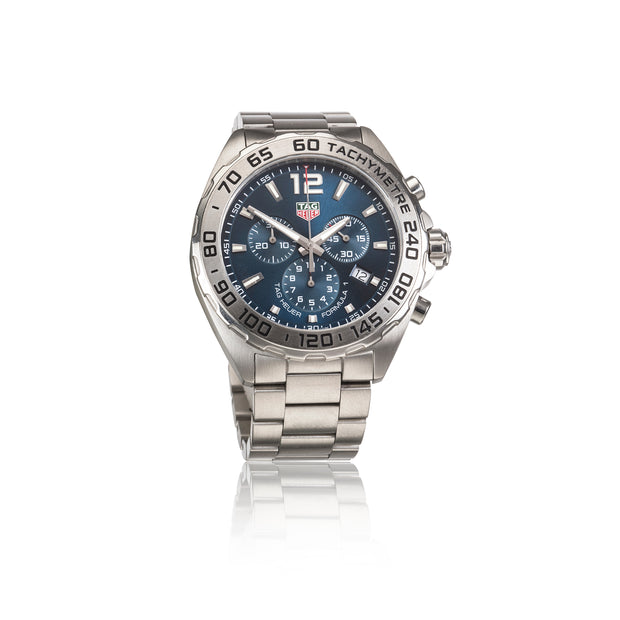 TAG Heuer Carrera watch with a stainless steel case and bracelet, featuring a blue dial with white markings and a tachymeter bezel.