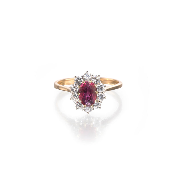 Vintage 18ct Two Tone Ruby and Diamond Cluster Halo Ring on white background