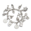 Silver charm bracelet with various charms on a white background