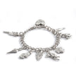 Silver charm bracelet with various charms on a white background